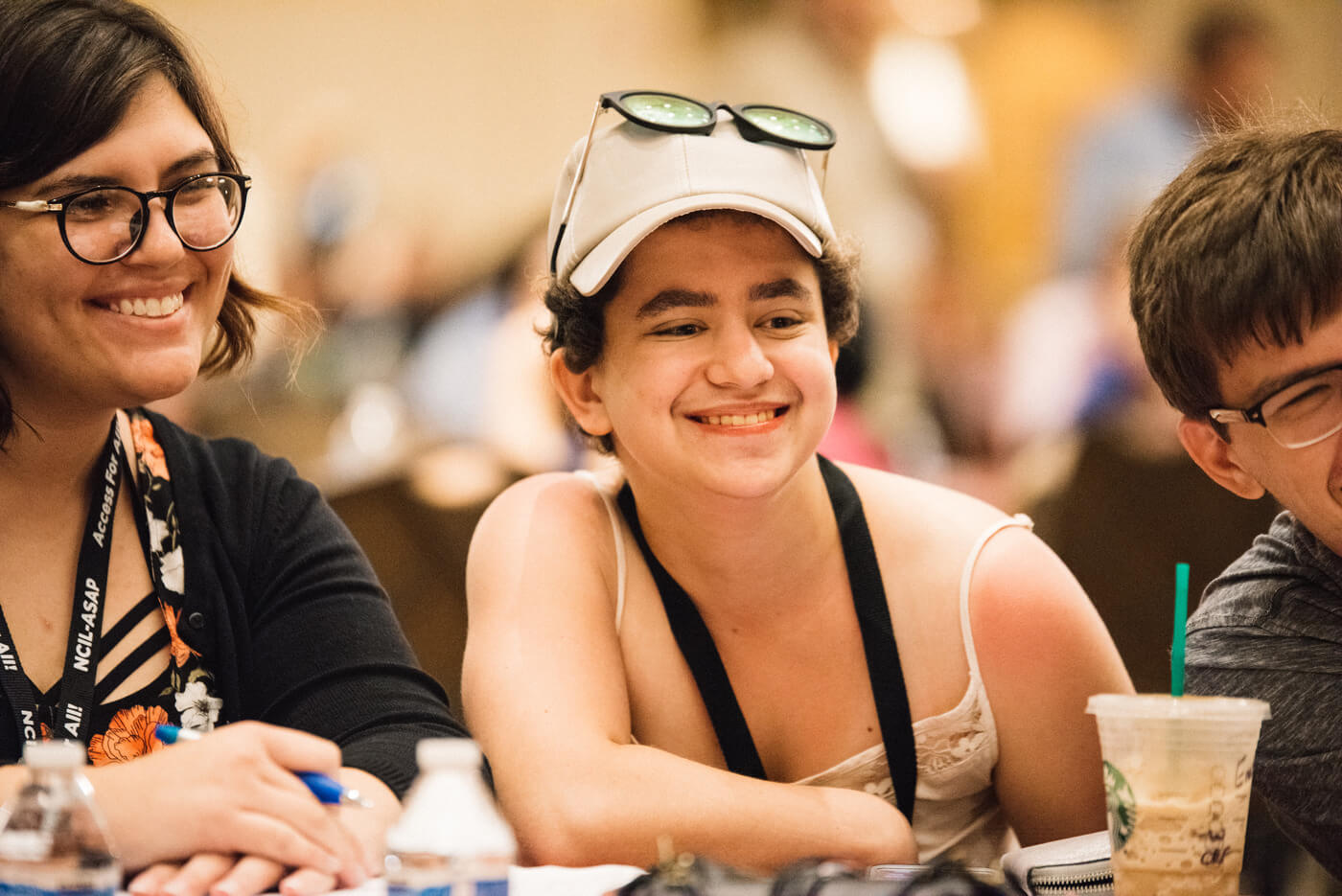 A group of three advocates smile at the camera.