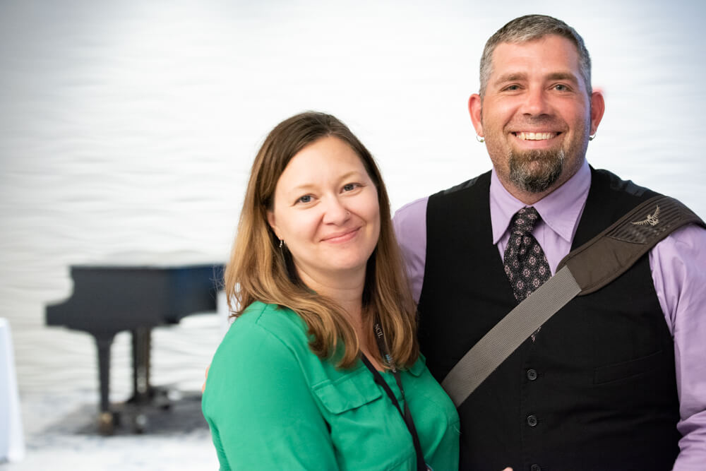 Angela Ellman and her husband pose for a photo.