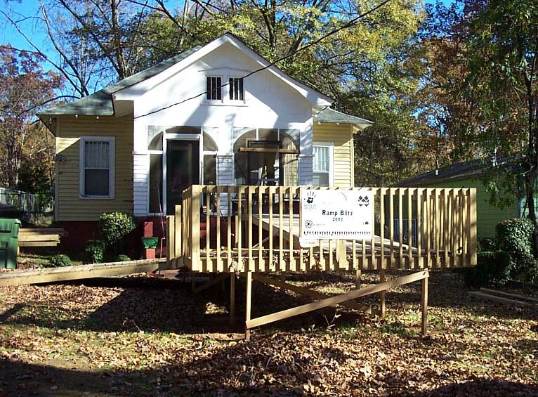 Example of bad add on - a house with a bulky wooden ramp added on
