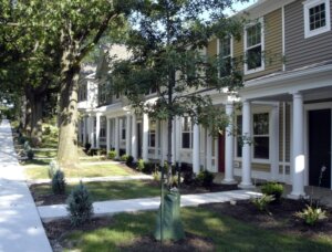 A housing complex with zero step entrances provided by concrete walkway