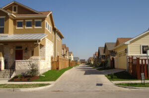 Raised alley leads to zero step entrances via attached garages in Austin, TX