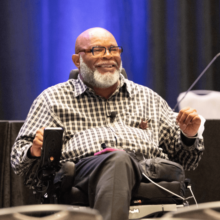 Theo Braddy – A black man with a bald head