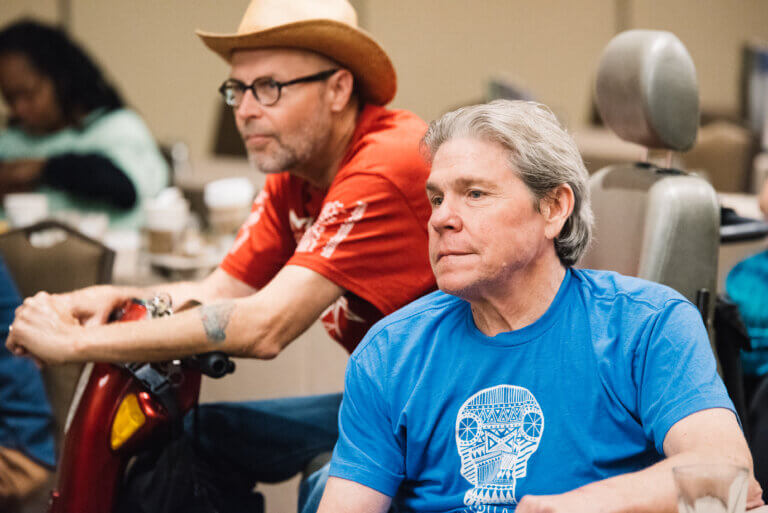 Tim Sheehan and Mike Oxford participate in the NCIL 2016 Annual Council Meeting from the conference floor.