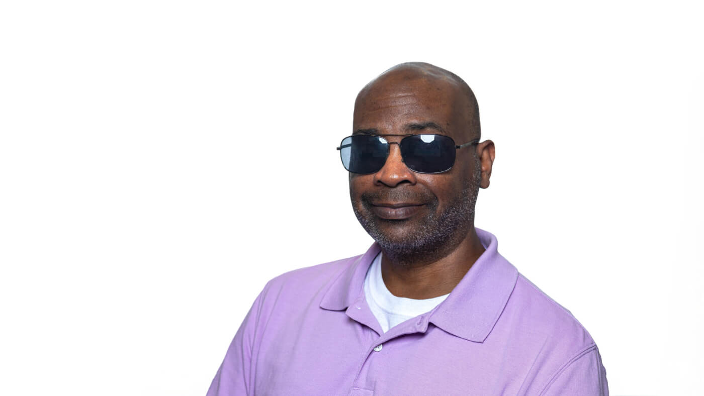 Headshot of Benjamin White from the 2025 Conference Headshot session. Each photo shows the NCIL member from the chest up, on a stark white background.