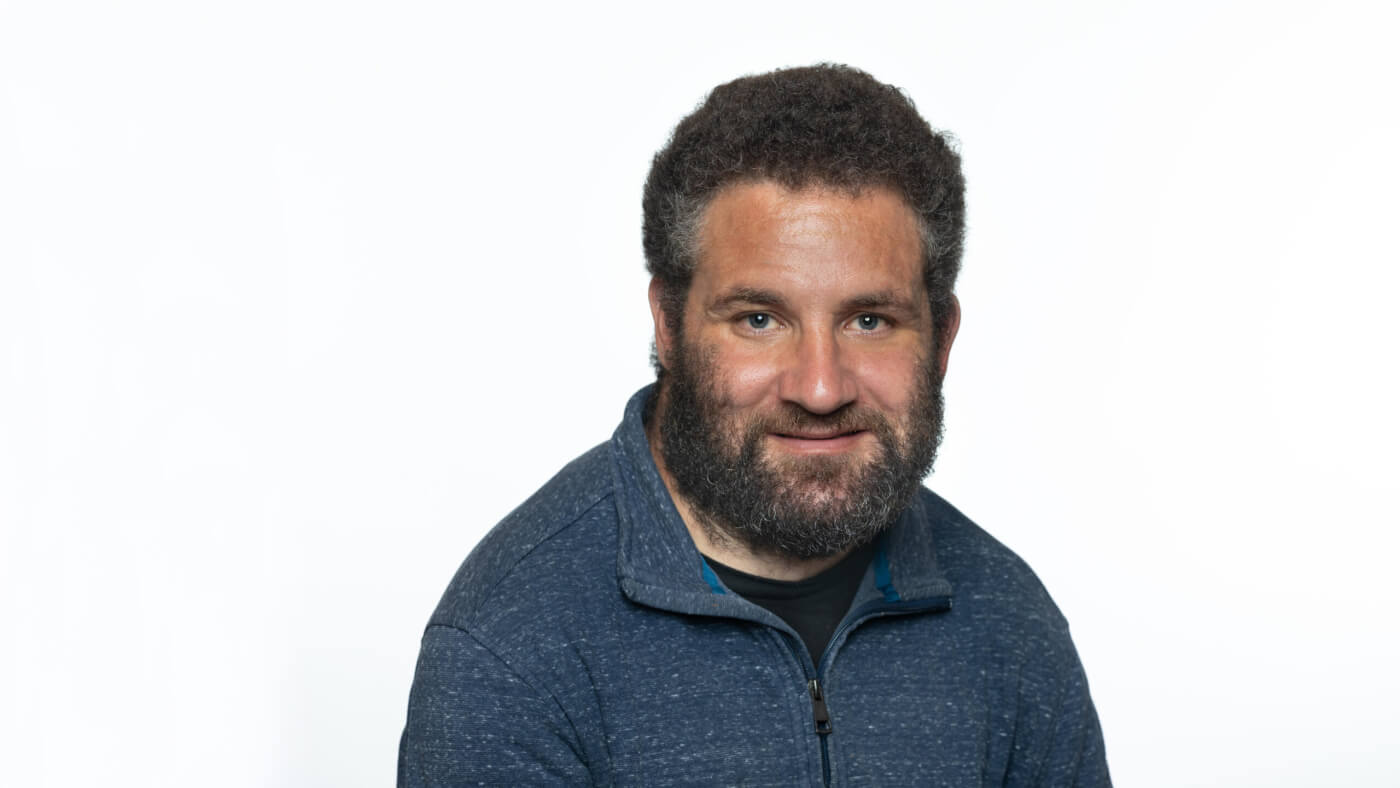 Headshot of Brendan Williams from the 2025 Conference Headshot session. Each photo shows the NCIL member from the chest up, on a stark white background.