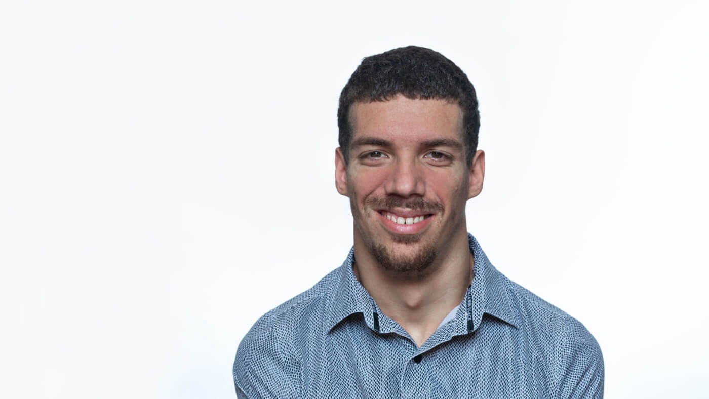Headshot of Cody Rooney from the 2025 Conference Headshot session. Each photo shows the NCIL member from the chest up, on a stark white background.
