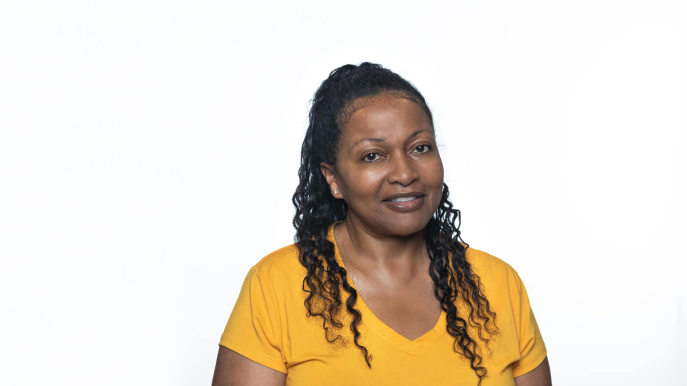 Headshot of Cynthia Brown from the 2025 Conference Headshot session. Each photo shows the NCIL member from the chest up, on a stark white background.