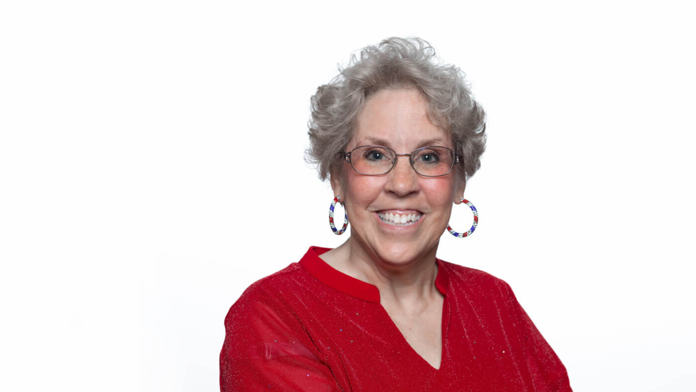Headshot of Ginni Buller from the 2025 Conference Headshot session. Each photo shows the NCIL member from the chest up, on a stark white background.