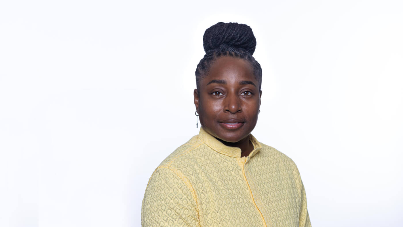 Headshot of Nasira Johnson from the 2025 Conference Headshot session. Each photo shows the NCIL member from the chest up, on a stark white background.