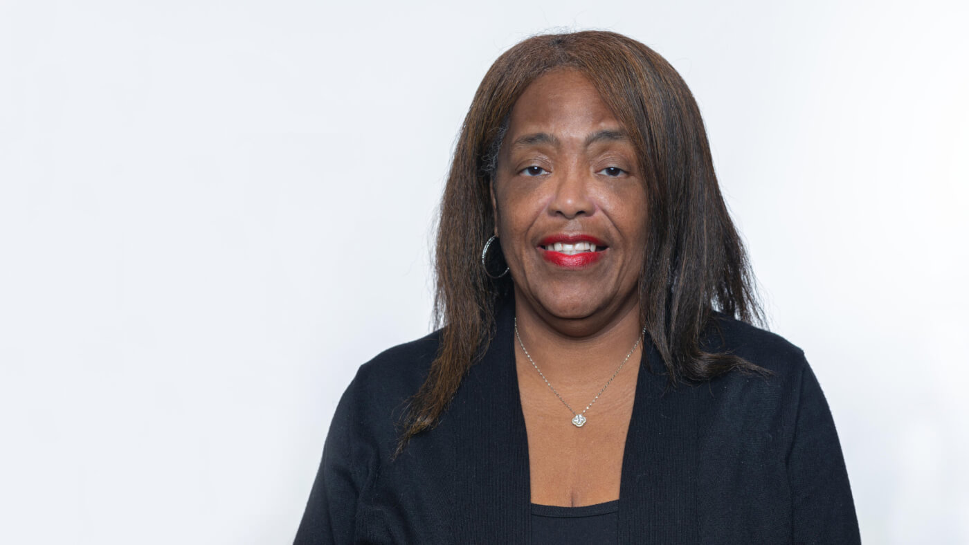 Headshot of Pamela Clark from the 2025 Conference Headshot session. Each photo shows the NCIL member from the chest up, on a stark white background.