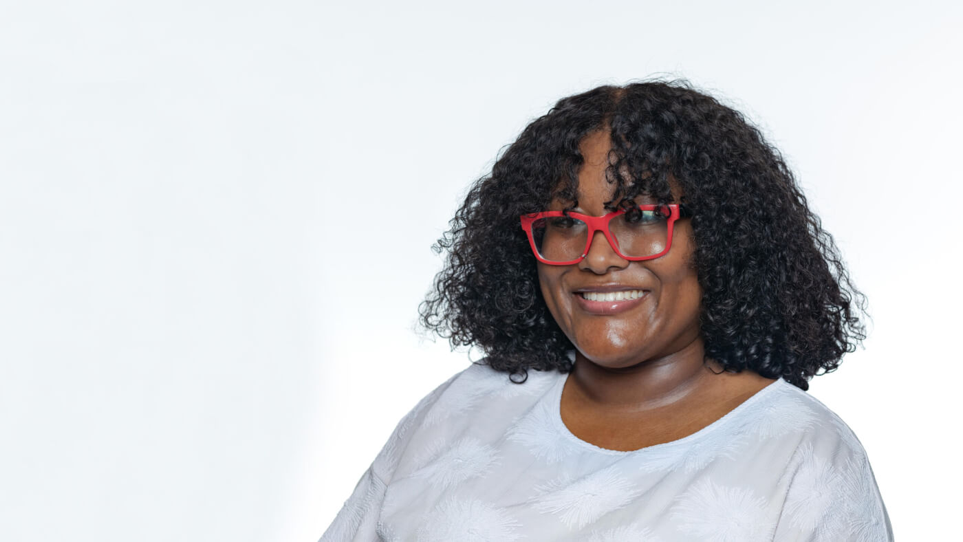 Headshot of Zakya Moses from the 2025 Conference Headshot session. Each photo shows the NCIL member from the chest up, on a stark white background.