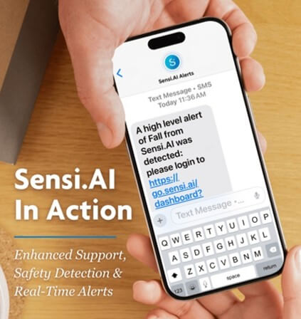 Photograph showing a person holding a smartphone displaying a text alert from Sensi.AI about a high-level fall detection, with a link to a dashboard. Text on the left highlights Sensi.AI's features of enhanced support, safety detection, and real-time alerts, alongside Assistance Home Care logo and establishment year.