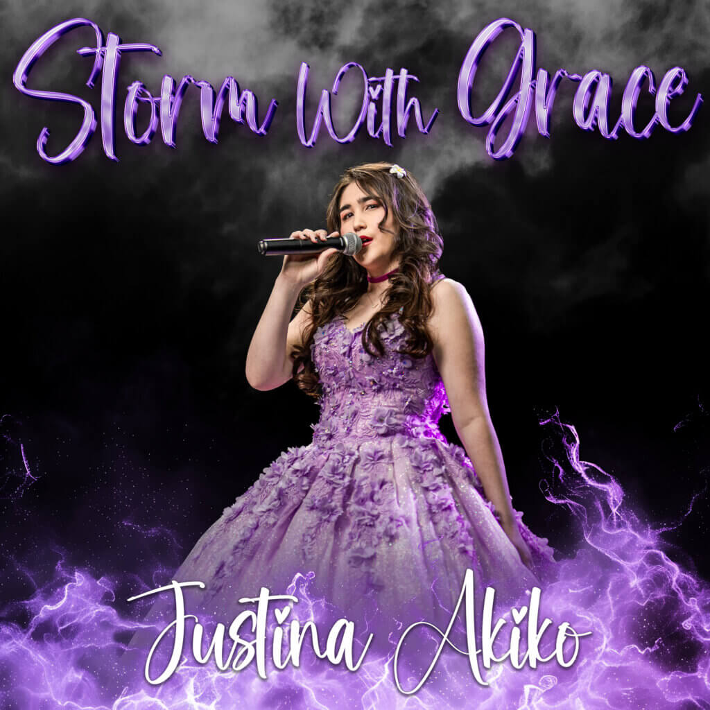 A performer stands center stage holding a microphone and wearing an elaborate lavender gown with floral details. Purple smoke and glowing effects surround the scene against a dark background, while the text “Storm With Grace” appears at the top and “Justina Akiko” is displayed at the bottom in decorative script.