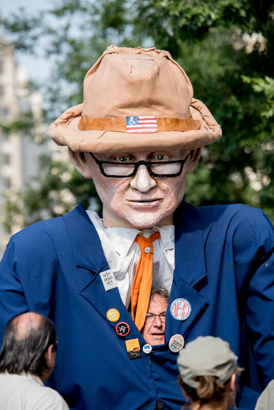 A puppeteer peeks out from the inside of the giant Justin Dart Puppet during NCIL’s 2015 March to the Capitol.